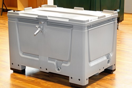 Operative handling commercial waste with high-visibility clothing